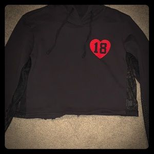 black crop top with #18, sheer sides